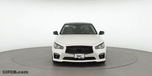 The Front Of A White Car With A License Plate That Says Shift GIF