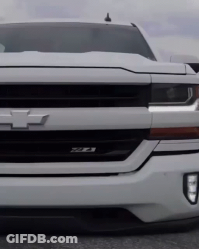 The Front Of A White Chevrolet Truck With The Letters Ztx On The Grille GIF