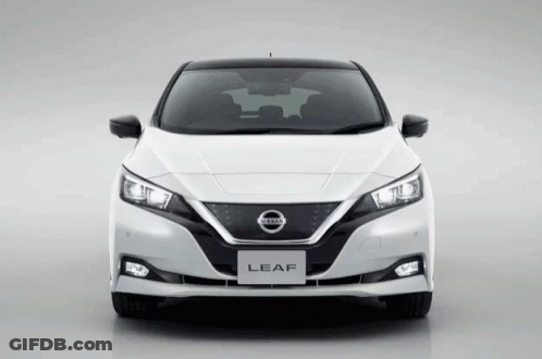 The Front Of A White Nissan Leaf With Black Trim GIF