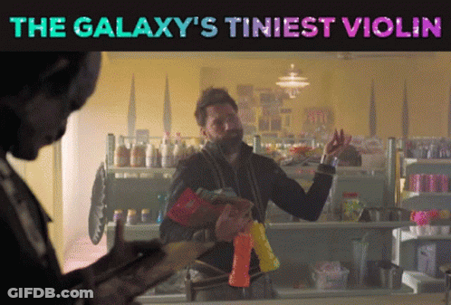 The Galaxy 'S Tiniest Violin Is Displayed On A Poster GIF