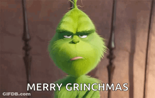 The Grinch From The Movie The Secret Life Of Dr. Seuss Is Looking At The Camera And Saying Merry Grinchmas . GIF