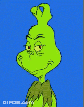 The Grinch Is A Cartoon Character With A Very Angry Face And Red Eyes . GIF