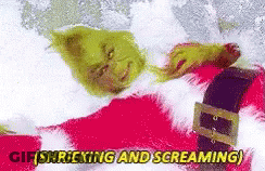 The Grinch Is Laying In The Snow And Screaming While Wearing A Santa Suit . GIF