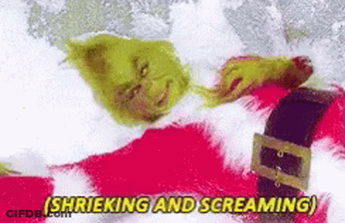 The Grinch Is Laying In The Snow And Screaming While Wearing A Santa Suit . GIF