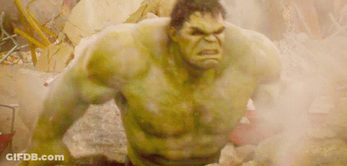 The Hulk Is Standing In A Pile Of Rocks And Smoke GIF