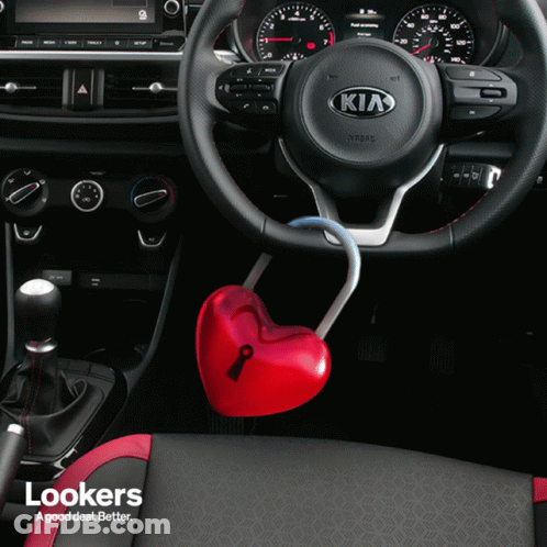 The Inside Of A Kia Car With A Heart Shaped Key GIF