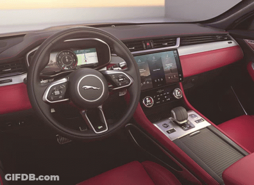 The Interior Of A Jaguar Car Has A Steering Wheel GIF