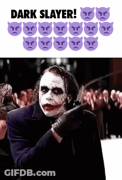 The Joker Is Holding A Knife In Front Of A Crowd And Says Dark Slayer ! GIF