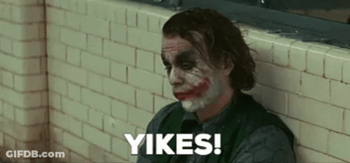The Joker Is Leaning Against A Brick Wall And Saying Yikes ! GIF