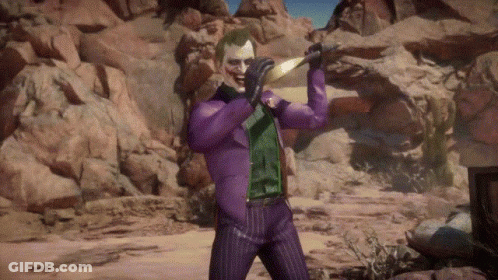The Joker Is Wearing A Purple Suit And Holding A Sword In His Hand . GIF