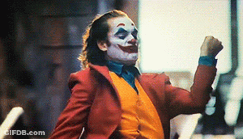 Joker In Red Suit And Yellow Vest Dancing GIF