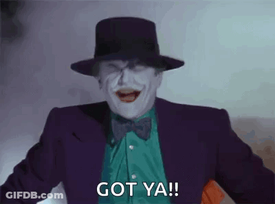 The Joker Is Wearing A Top Hat And Bow Tie And Is Laughing And Saying `` Got Ya '' . GIF