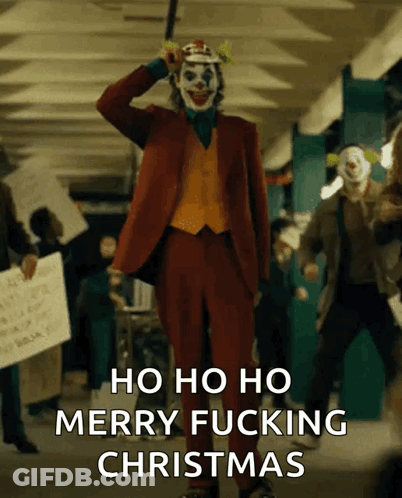 The Joker Says Merry Fucking Christmas In Front Of A Crowd Of Protesters GIF