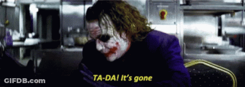 The Joker Says Ta-Da It 'S Gone In A Dark Room . GIF