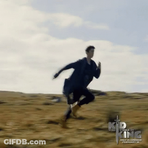 The Kid Who Would Be King Poster Man Running In Field GIF