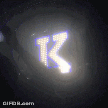 The Letter K Is Glowing In The Dark With A Purple Background GIF