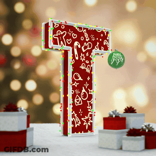 The Letter T Is Decorated With Christmas Lights And A Christmas Ornament GIF