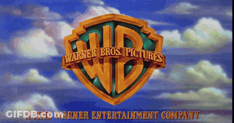 The Logo For Warner Bros. Pictures Against A Blue Sky With Clouds GIF