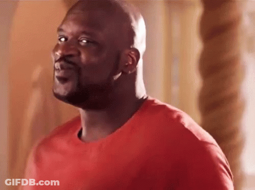 The Man Is Wearing A Red Shirt And Looking At The Camera . GIF