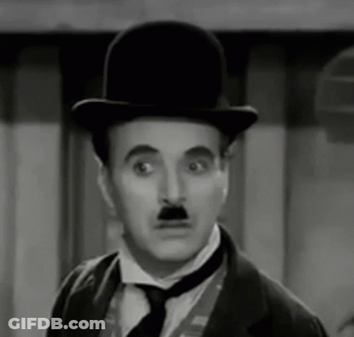 The Man Is Wearing A Top Hat And Tie And Has A Mustache . GIF
