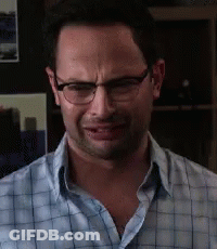 The Man Is Wearing Glasses And A Plaid Shirt GIF