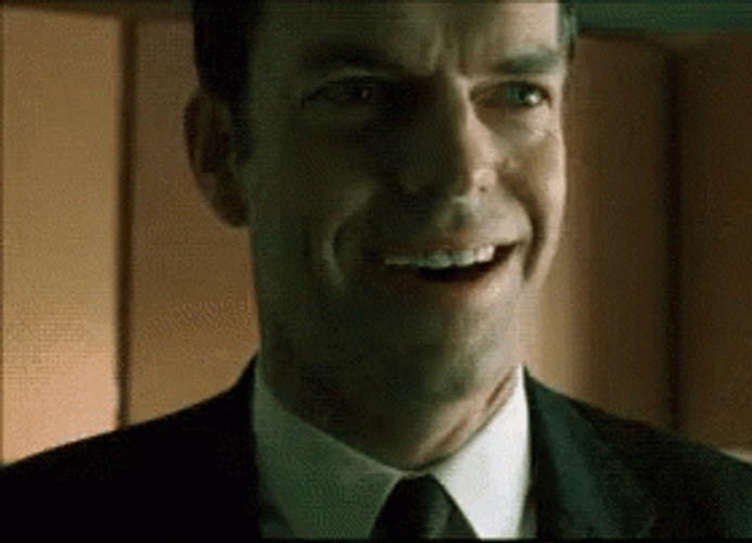 The Matrix Agent Smith Laugh GIF