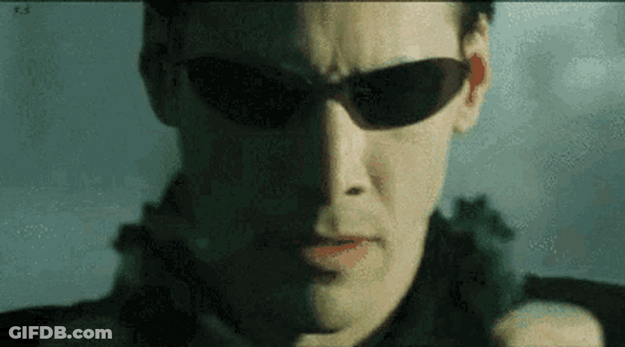 The Matrix Neo Firing Guns GIF