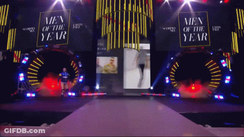 The Men Of The Year Awards Are Being Held On A Stage GIF