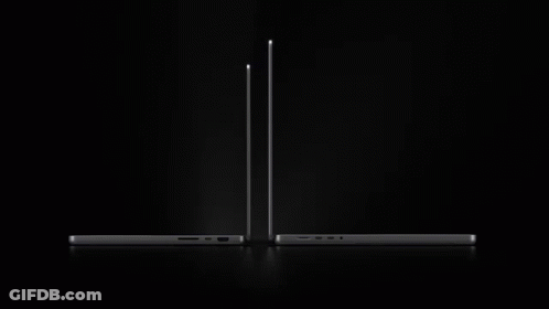 The New Macbook Pro Is Being Advertised On A Black Background GIF