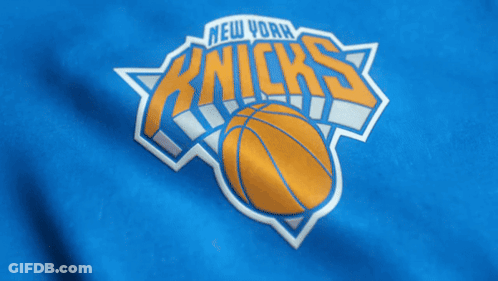 The New York Knicks Logo Is On A Blue Shirt GIF