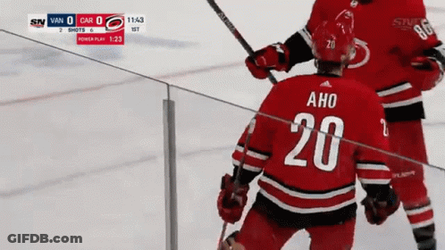 The Number 20 Is On The Back Of A Hockey Jersey GIF