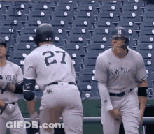 The Number 27 Is On The Back Of A Baseball Player 'S Jersey GIF