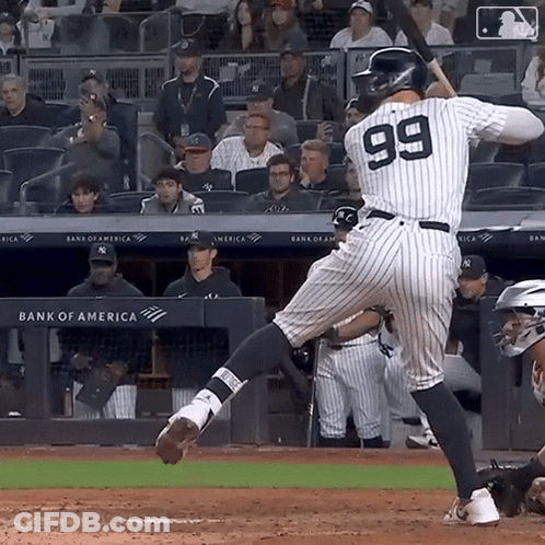 The Number 99 Is On The Back Of A Baseball Player GIF