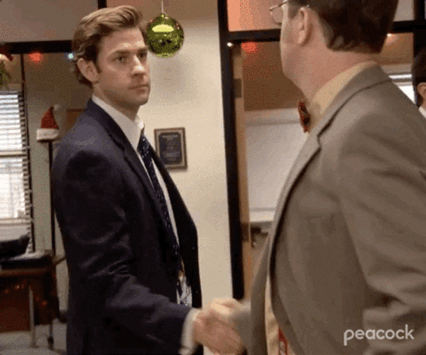 The Office Christmas Aggressive Handshake GIF