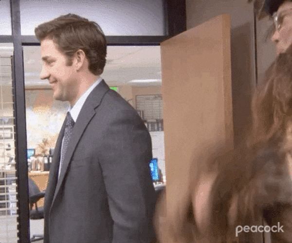 The Office Christmas Jim Hit By Belsnickel GIF