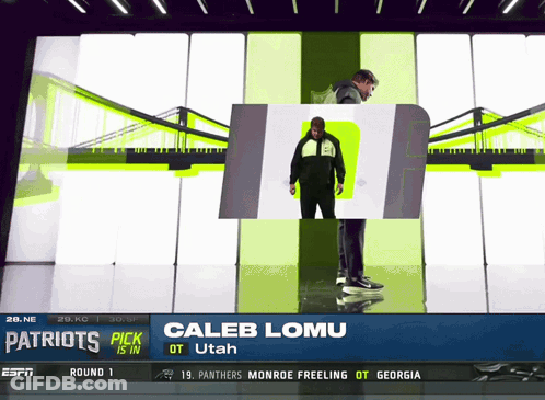 The Patriots Pick Caleb Lomu Is Standing In Front Of A Bridge GIF