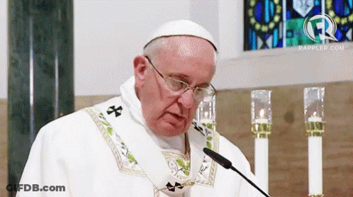 The Pope Is Wearing Glasses And A White Robe GIF