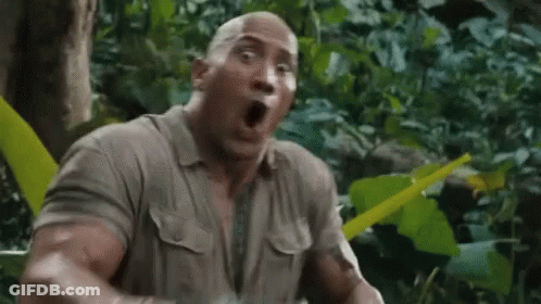 The Rock Is Making A Surprised Face In The Jungle While Holding A Machete . GIF