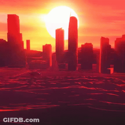 The Sun Is Setting Over A City With A Lot Of Buildings GIF