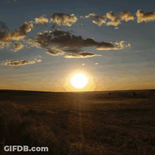 Sunset Over Field With Clouds GIF