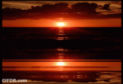 The Sun Is Setting Over The Ocean And The Letters I And J Are Reflected In The Water GIF