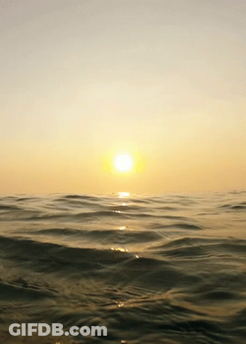 Sunset Over Ocean Waves Breaking GIF