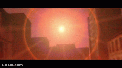 The Sun Is Shining Brightly Over A City With Buildings In The Foreground . GIF