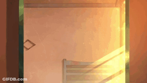 The Sun Is Shining Through A Window In A Bedroom GIF
