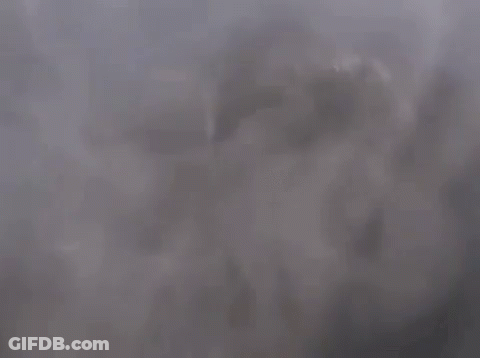 The Sun Is Shining Through The Clouds And Smoke Is Coming Out Of Them GIF