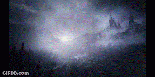The Sun Is Shining Through The Clouds Over A Forest . GIF