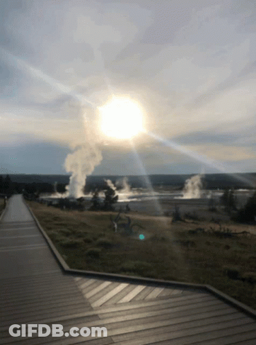 The Sun Is Shining Through The Clouds Over A Geyser Field GIF