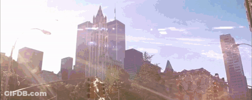 The Sun Is Shining Through The Windows Of A City Skyscraper GIF