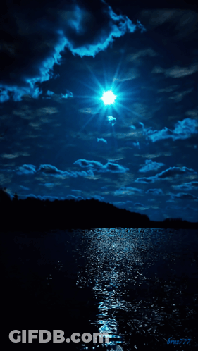 Bright Sun In Night Sky Over Water GIF
