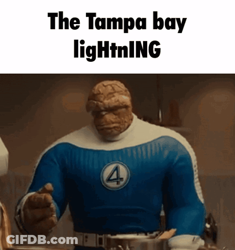 The Thing From The Fantastic Four Is Pointing At The Camera While Wearing A Blue And White Costume . GIF